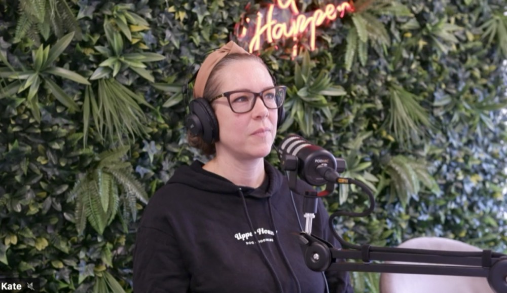 Kate from Upper Hound in headphones at a microphone